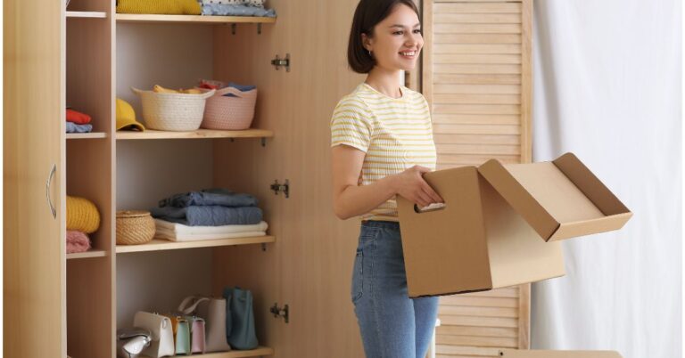 young women organizing clothes in the wardrobe as a soft decluttering method, small steps for decluttering