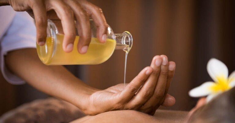 women making massage with castor oil