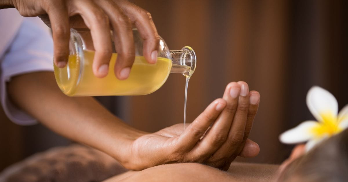 women making massage with castor oil
