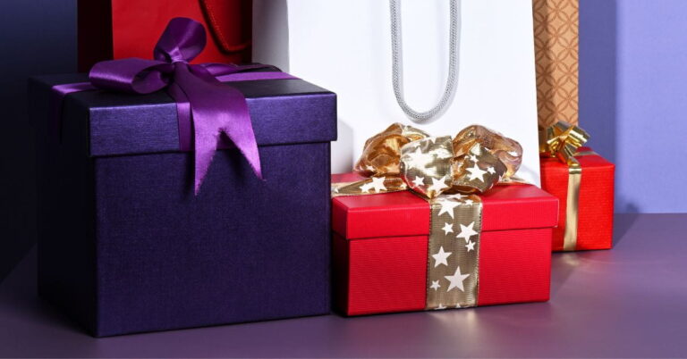 Gift Ideas for Women Who Have Everything: Beautiful and Thoughtful Picks with purple present box and red present box on a lavender colored table