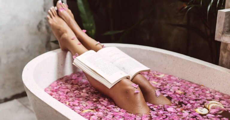 taking a relaxing bath and reading a book is a great practice for How to Build Self-Love After Burnout
